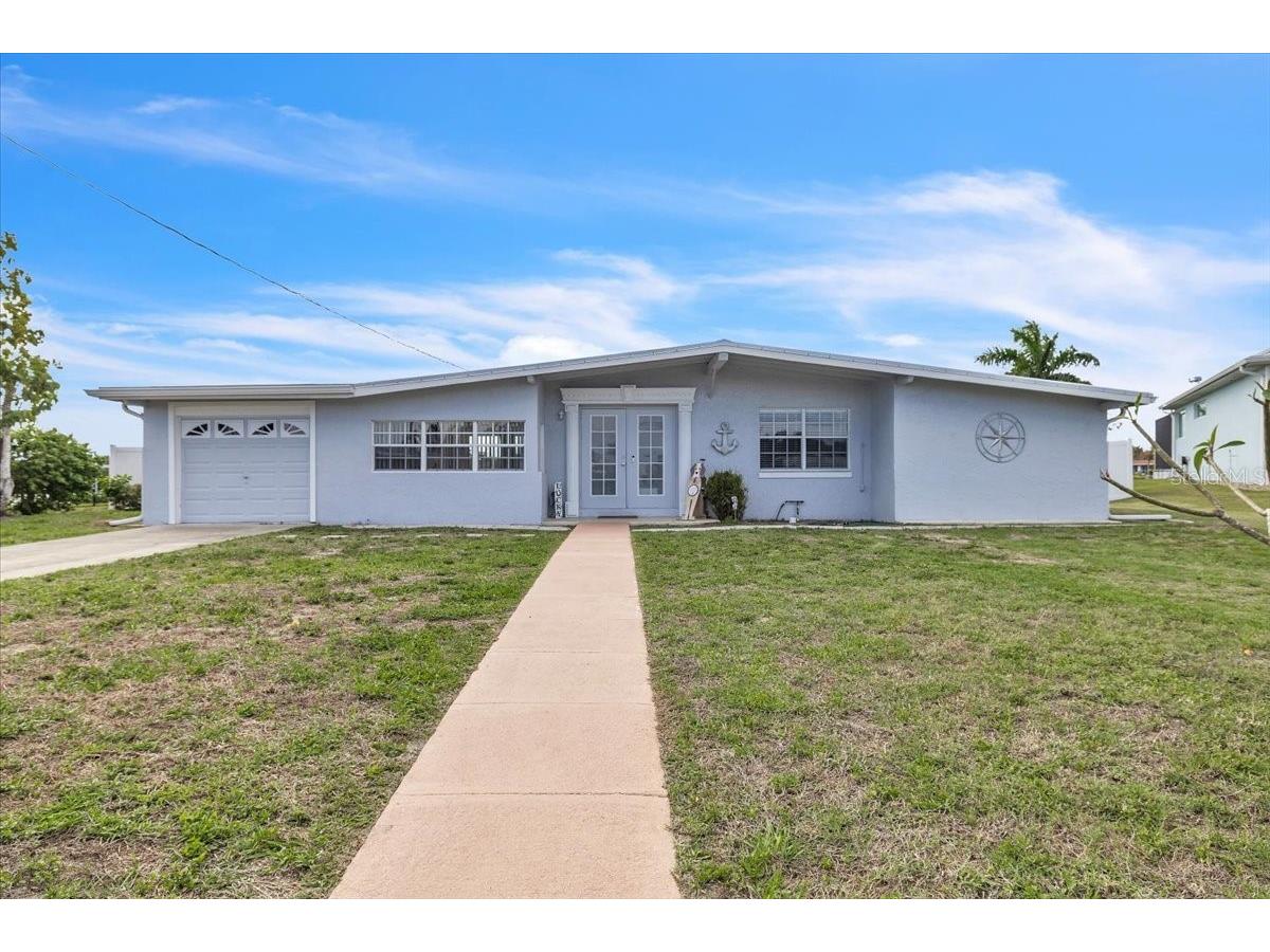 137 Poinsettia Circle NE Port Charlotte FL 33952 - ELKCAM WATERWAY C7523601 image1
