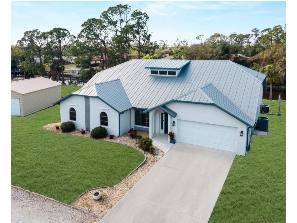 908 Tropical Circle NW Port Charlotte FL 33948 - PELLAM CANAL C7506741 image1