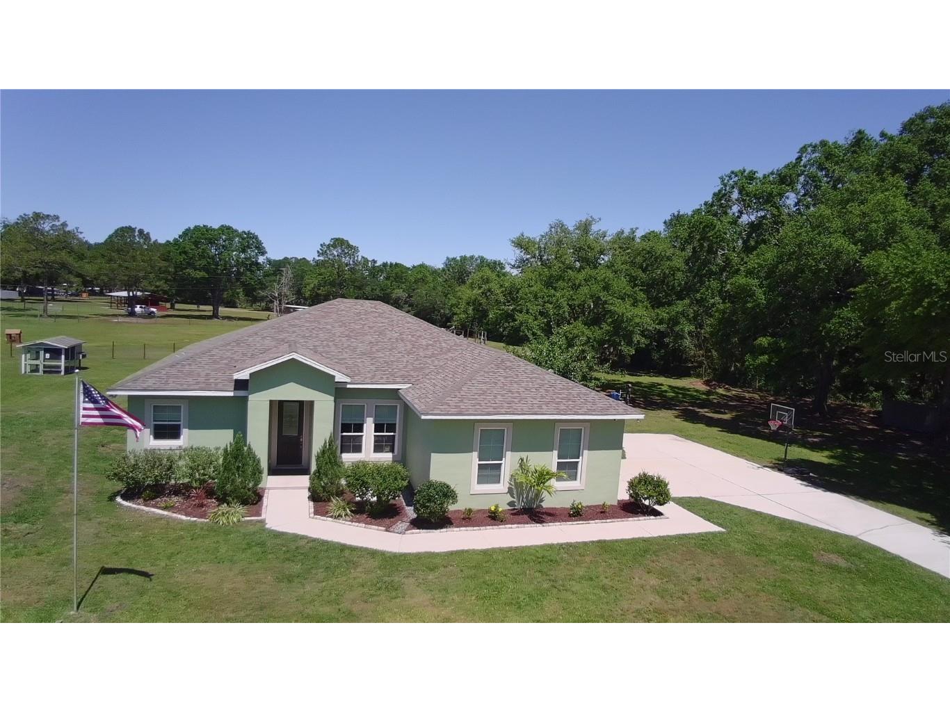 9876 Pangola Loop Land O Lakes FL 34639 - DRAINAGE CANAL TB8376616 image1