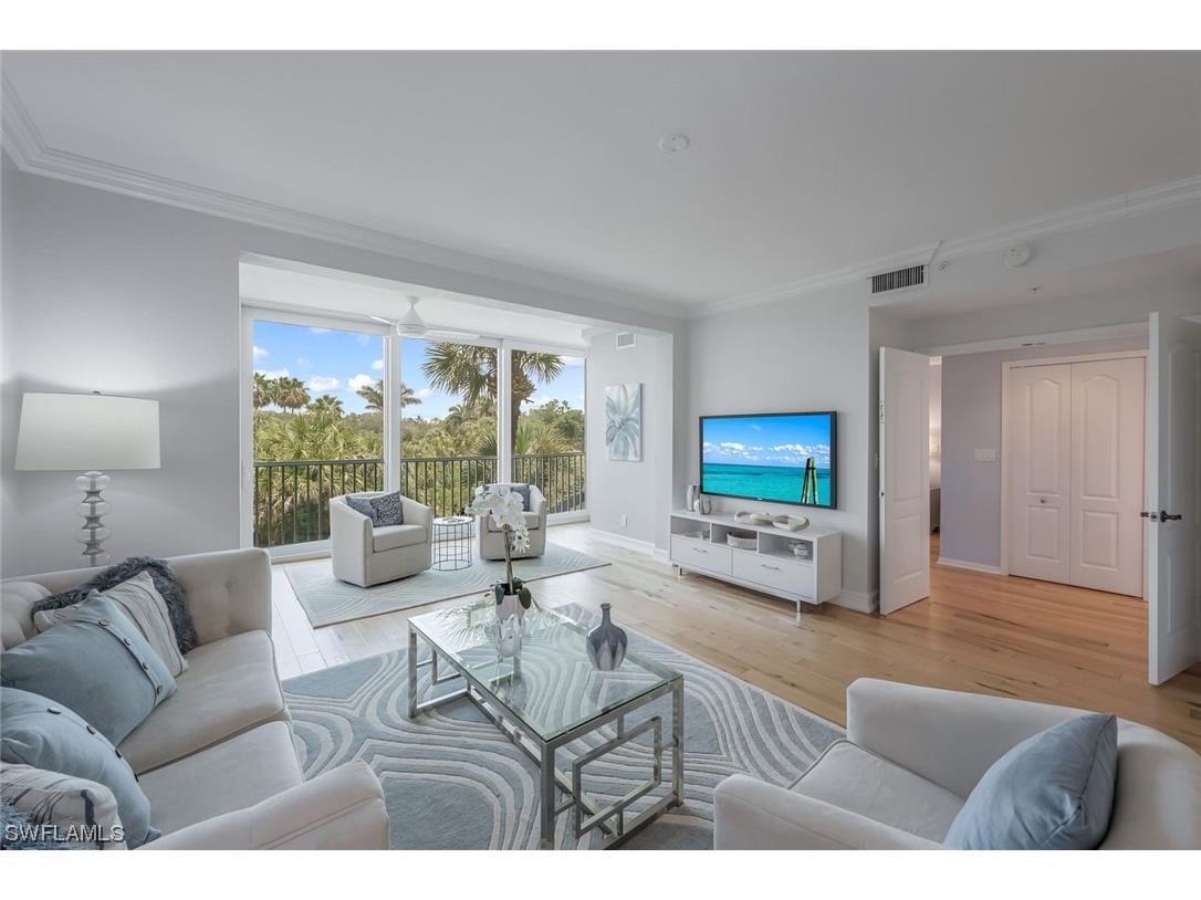 7687 Pebble Creek Circle #201 Naples FL 34108 223050477 image1